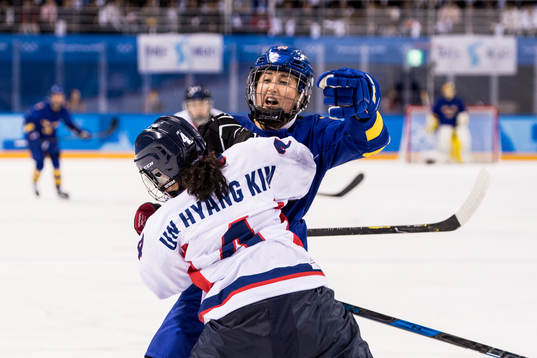 Fanny Rask of Sweden in action with Kim Un Hyang of Korea