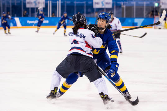 Fanny Rask of Sweden in action with Kim Un Hyang of Korea
