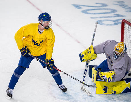 Rasmus Dahlin of Sweden and Goaltender Jhonas Enroth of
