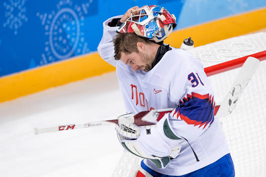 Goaltender Lars Haugen of Norway looks dejected  in the