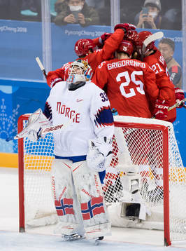 Goaltender Henrik Haukeland of Norway looks dejected