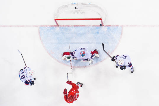 Goaltender Lars Haugen of Norway lets in the 3-0 goal in