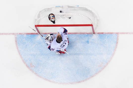 Goaltender Lars Haugen of Norway looks dejected in the