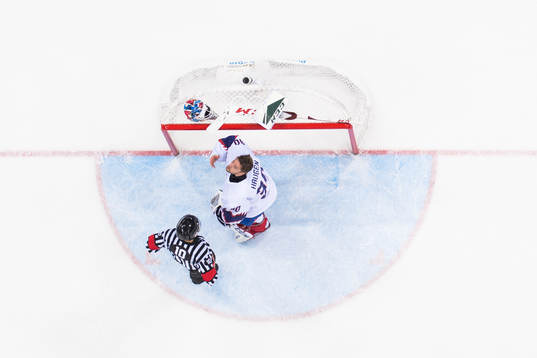 Goaltender Lars Haugen of Norway looks dejected in the
