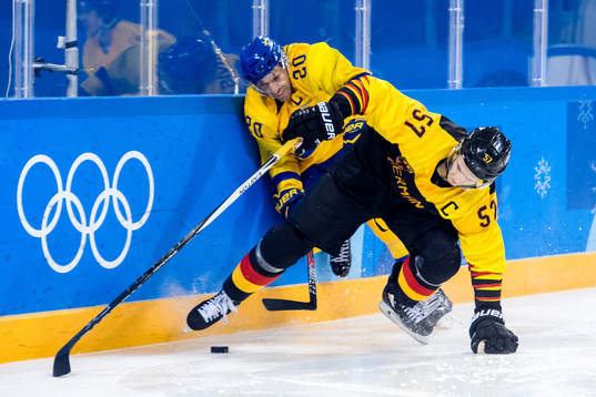 Joel Lundqvist of Sweden and Marcel Goc of Germany in the