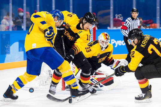 Joel Lundqvist of Sweden in action with Christian Ehrhoff,