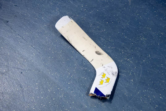 Goaltender Viktor Fasth of Sweden broke his stick in