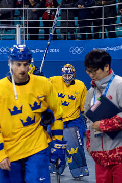 Goaltender Viktor Fasth of Sweden breaks his stick