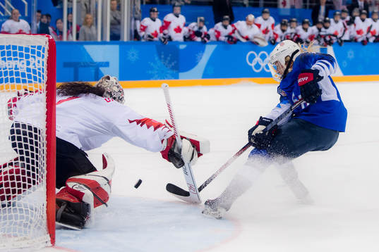 Gigi Marvin of USA scores a shootout goal behind Shannon
