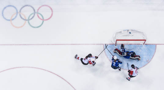 Goaltender Maddie Ronney of USA makes a save against