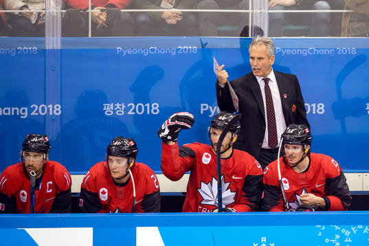 Canada's head coach Willie Desjardins looks dejected in the
