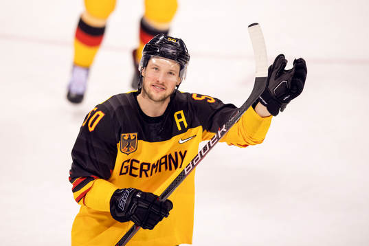 Patrick Hager of Germany celebrates in the Men's ice hockey