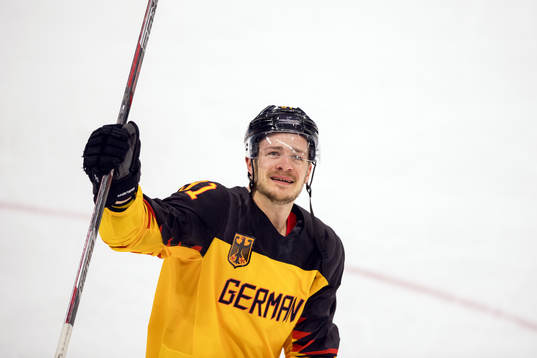 Moritz Müller of Germany celebrates in the Men's ice