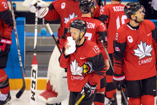 Andrew Ebbett of Canada looks dejected