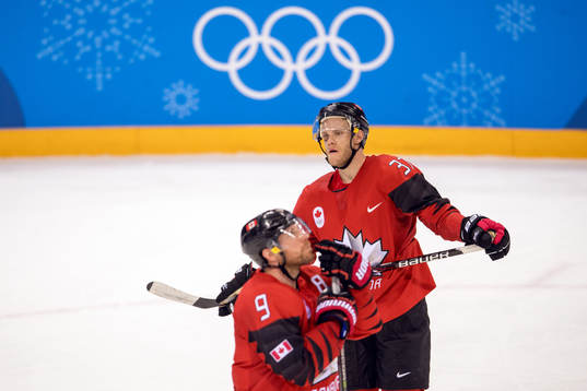 Mat Robinson and Derek Roy of Canada looks dejected