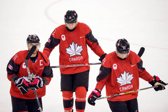 Chris Kelly, Rob Klinkhammer and Mason Raymond of Canada