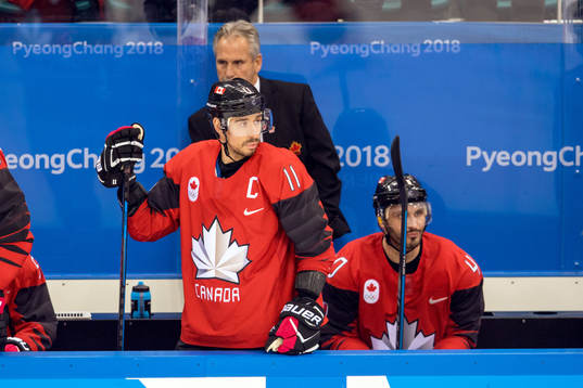 Chris Kelly and Maxim Lapierre of Canada looks dejected