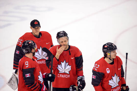 Goaltender Justin Peters, Derek Roy, Andrew Ebbett and