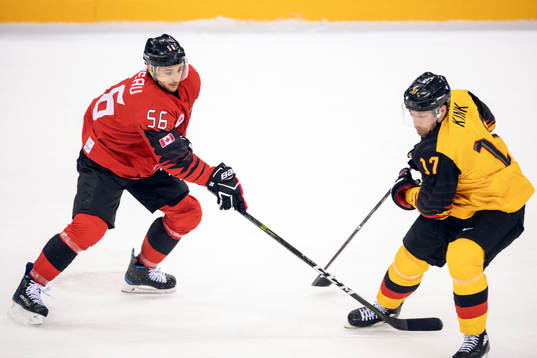 Maxim Noreau of Canada and Marcus Kink of Germany in the