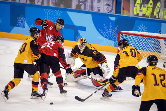 Eric O'Dell of Canada in front of goalkeeper Danny aus