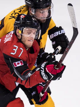 Brooks Macek of Germany and Mat Robinson of Canada in the