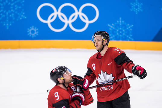 Mat Robinson and Derek Roy of Canada looks dejected