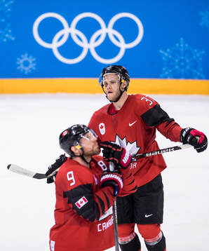 Mat Robinson and Derek Roy of Canada looks dejected