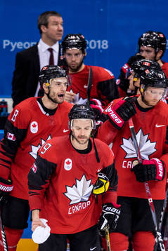 Andrew Ebbett of Canada looks dejected