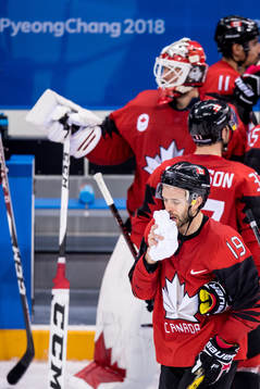 Andrew Ebbett of Canada looks dejected