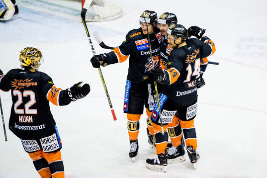 Nick Pageau of Frisk Asker celebrates with teammates