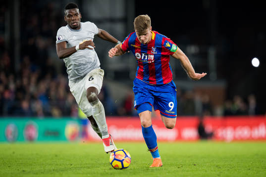 Paul Pogba of Manchester United and Alexander Sørloth of