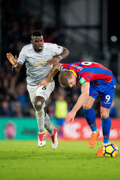 Paul Pogba of Manchester United and Alexander Sørloth of
