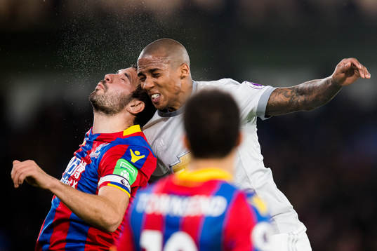 Luka Milivojevic of Crystal Palace and Chris Smalling of
