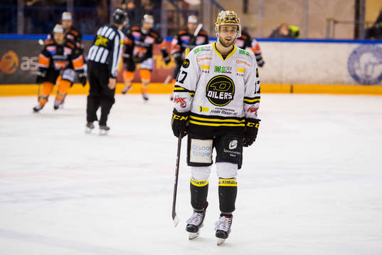 Eirik Østrem Salsten of Stavanger Oilers looks dejected