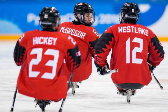 Tyler McGregor of Canada celebrates with teammates