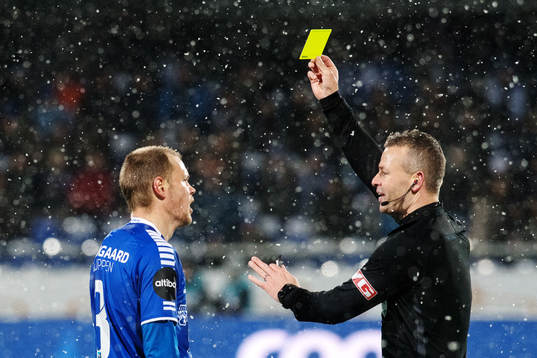 Matti Lund Nielsen gets a yellow card from the referee