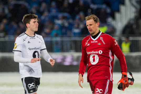 Jacob Rasmussen and goalkeeper André Hansen of Rosenborg