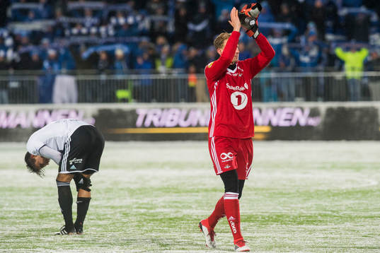 Anders Trondsen and goalkeeper André Hansen of Rosenborg