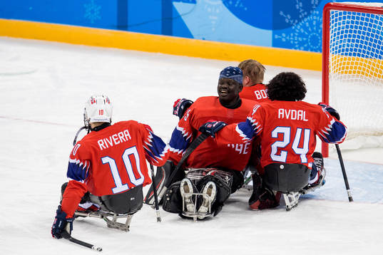 Goaltender Kissinger Deng of Norway celebrates with