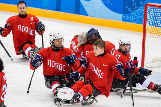 Lena Schrøder and goaltender Kissinger Deng of Norway