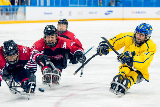 Markus Holm of Sweden shoots past Eiji Misawa and Kazuhiro