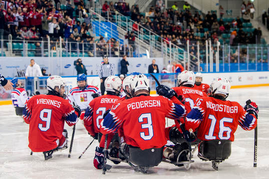 Rolf Einar Pedersen of Norway celebrates with teammates