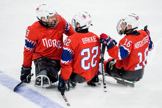 Audun Bakke of Norway celebrates with teammates Jan Roger