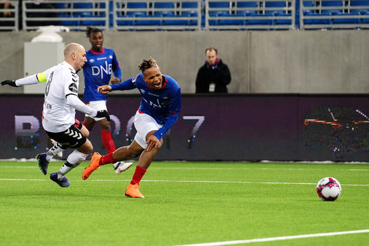 Jone Samuelsen of Odd tackles Chidera Ejuke of Vålerenga
