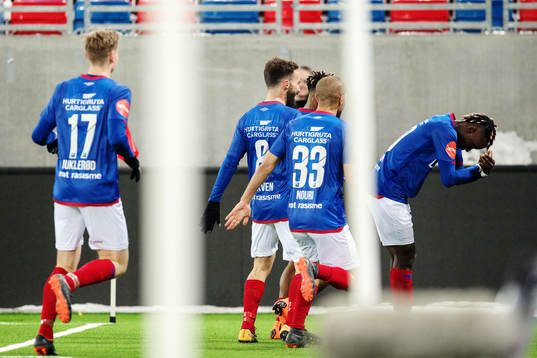 Sam Johnson of Vålerenga (right) celebrates scoring the