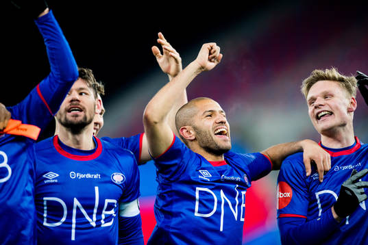 Daniel Fredheim Holm and Amin Nouri of Vålerenga celebrate