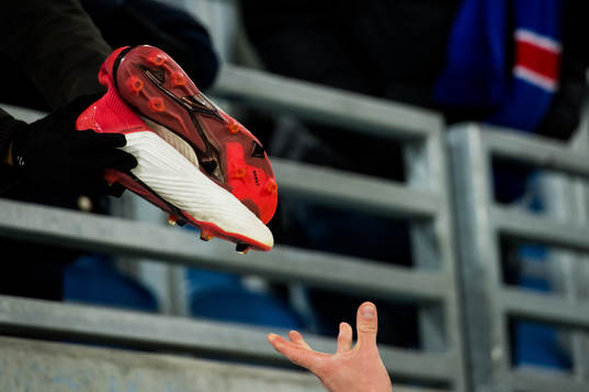 Football shoes are given to supporters