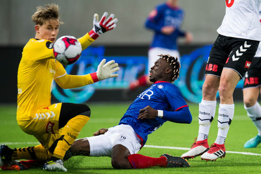 Goalkeeper Sondre Løvseth Rossbach of Odd and Sam Johnson