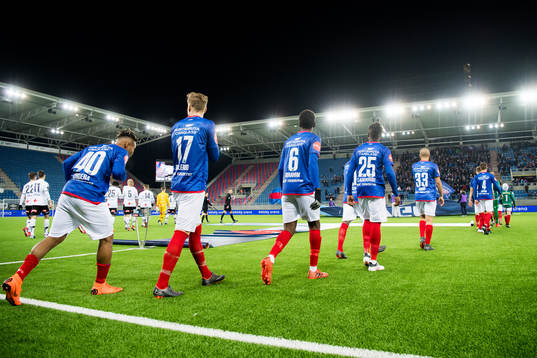 The Vålerenga players enter the pitch