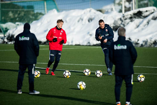 Martin Ødegaard of Norway and Per Joar Hansen, assistant